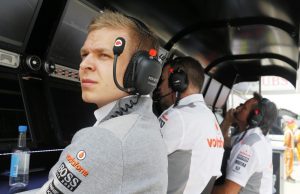 Kevin Magnussen watches the session from the pit wall.
