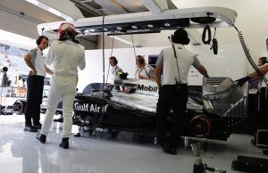 Title: Kevin Magnussen in the garage.